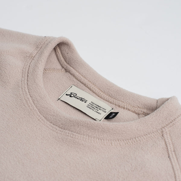 close up of fleece detailing on crewneck and bather tag